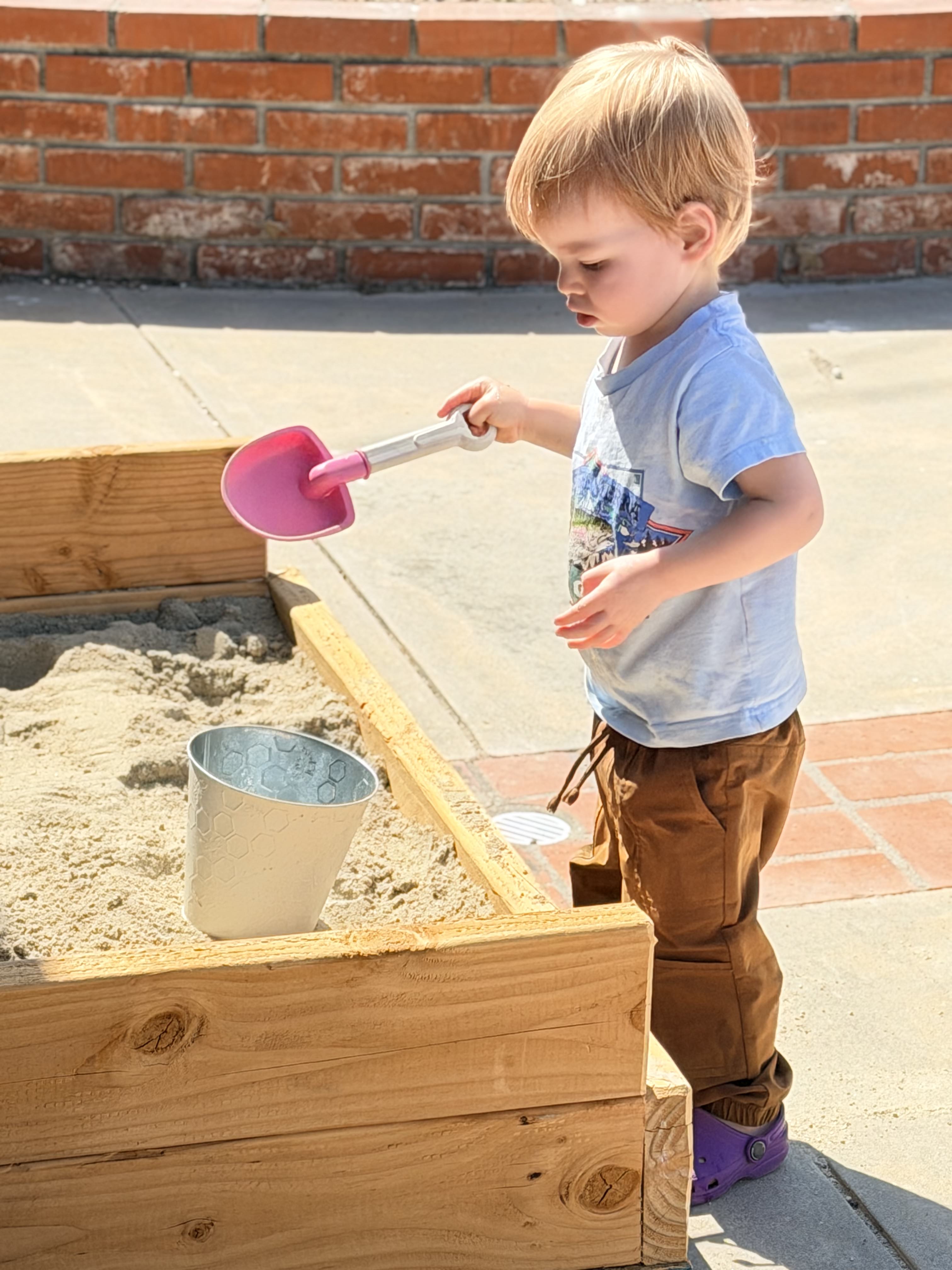 Boy playing in the sandbox