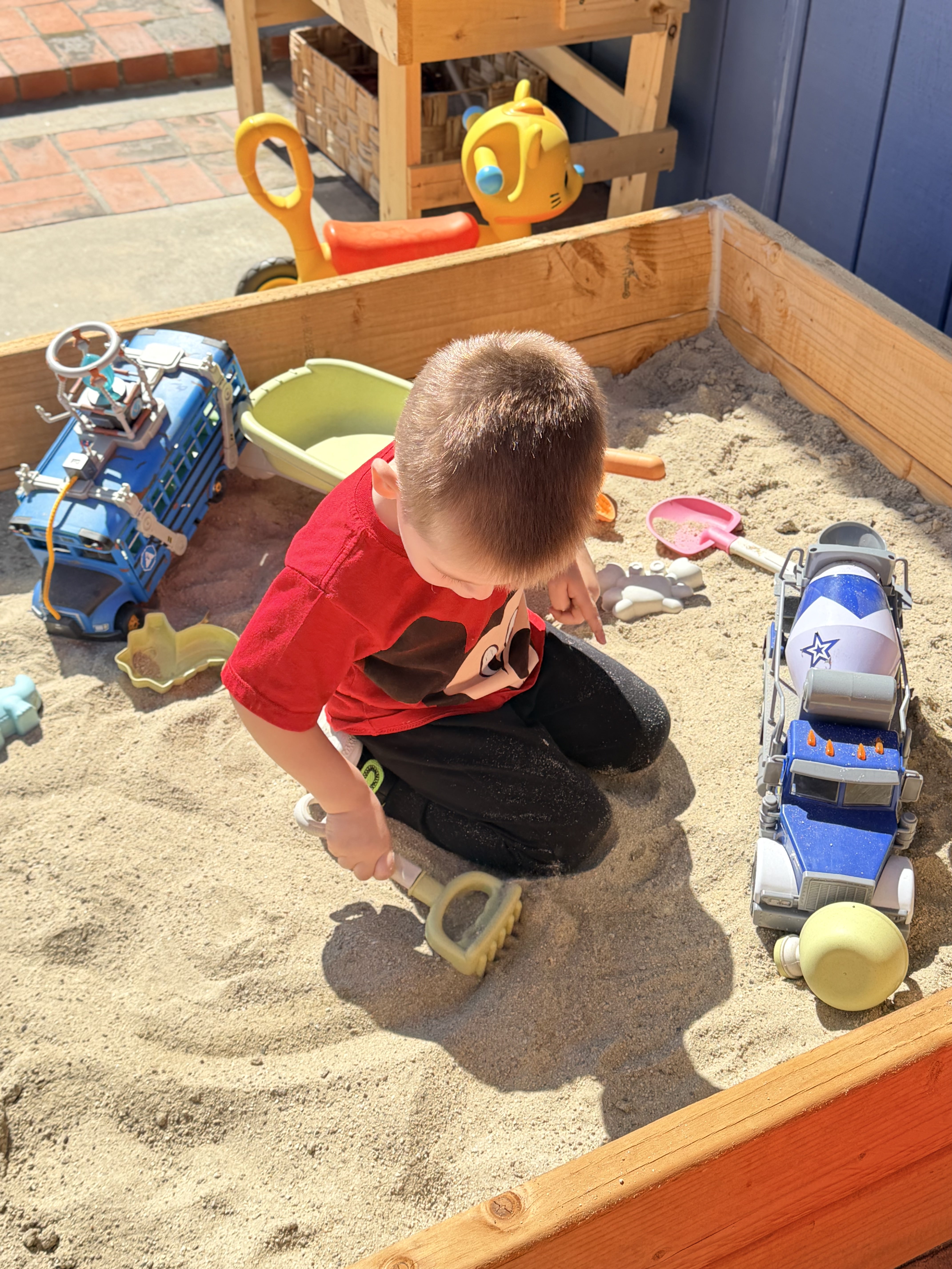 Boy playing in sandbox