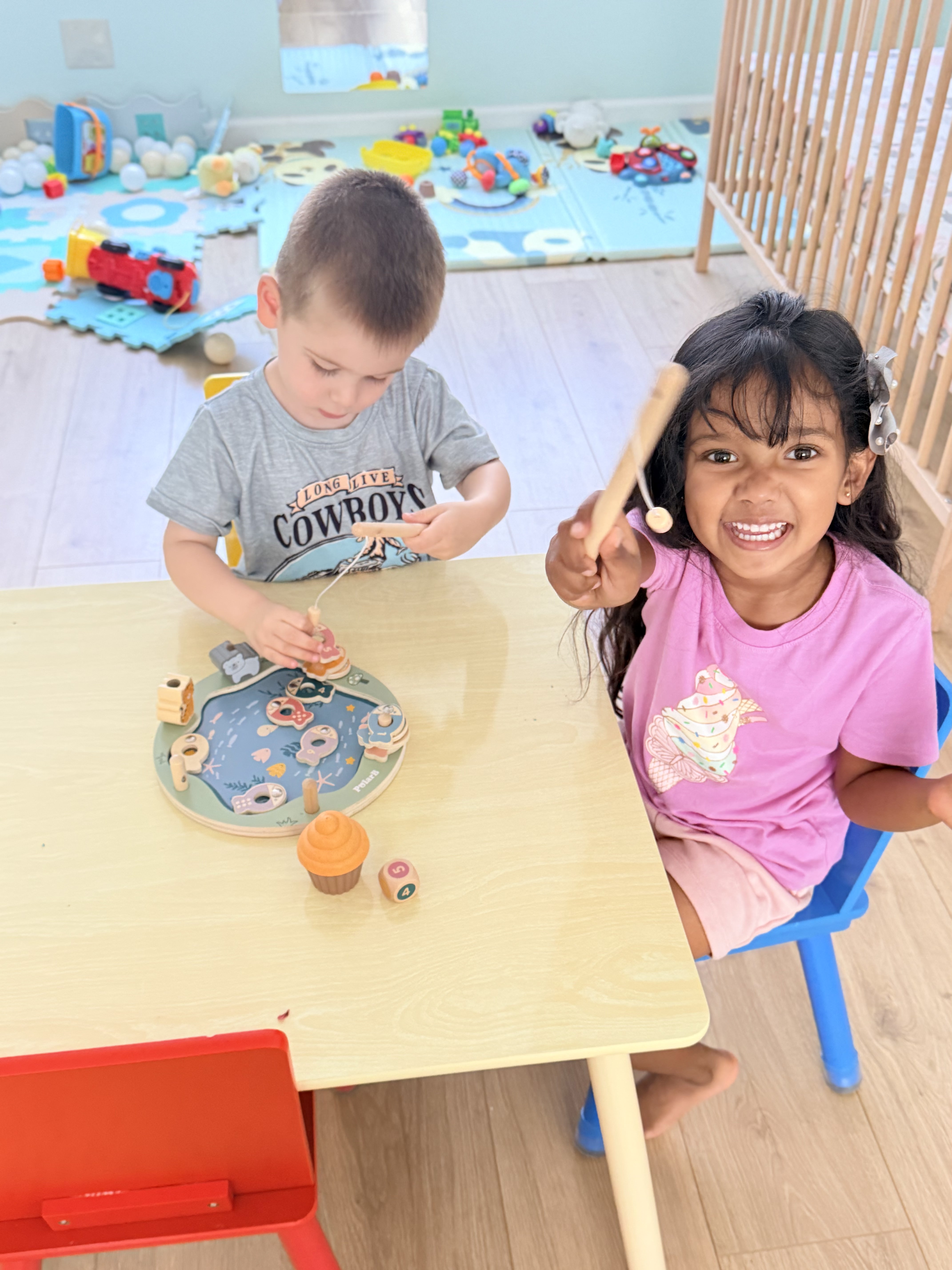 Two kids playing together at Happy Hive
